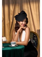 Tea party with large felt headdress hat